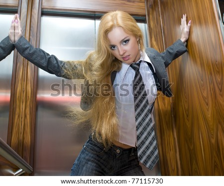 Portrait of the beautiful blonde girl in the lift
