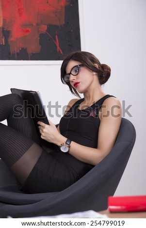 Young businesswoman working at the office everyday tasks