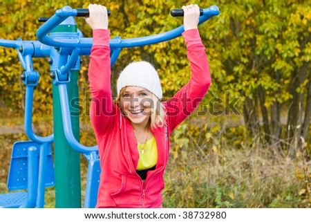 Young nice blond woman during fitness outdoor