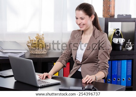 Elegant business woman work on the notebook in the office.