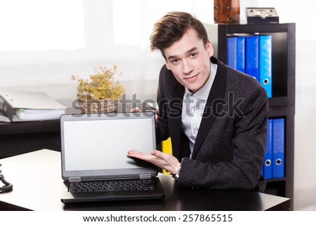 Business man show the laptop in the office