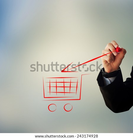 Business and advertisement concept. Close up of businessman drawing a shopping cart