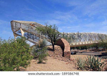 TUCSON, ARIZONA, USA --April 22, 2014:  Head end of the diamondback rattlesnake covered bridge over Broadway downtown.  One of many city art projects in need of repair but lacks the funds to do so.