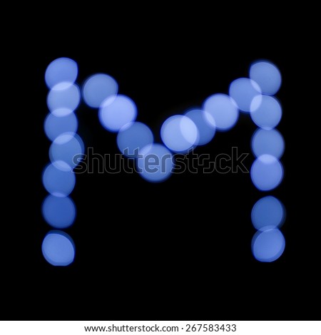 letter of Christmas lights on a dark background, the letter M, \