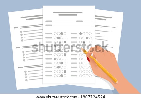 The student filling out answers to exam test answer sheet with a pencil. School and Education. Test score sheet with answers