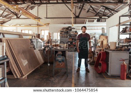 Similar – Image, Stock Photo Focused male carpenter working with wood in workshop