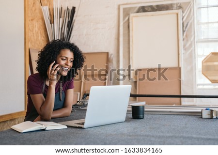 Image, Stock Photo Female artisan with frame standing in art workshop