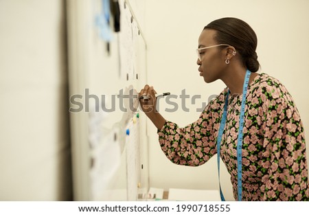 Similar – Image, Stock Photo Female artisan working with paints in workshop