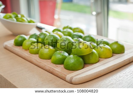 Fresh colorful, green limes limes on a tray