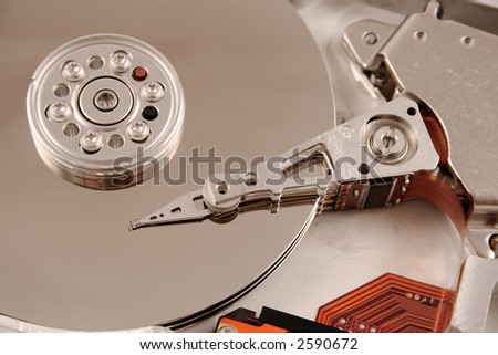 A close up macro of an opened computer harddrive.