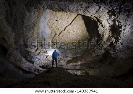 man in a huge cave