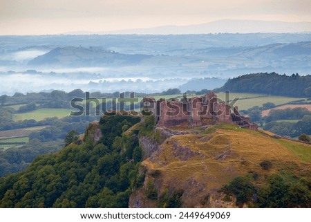 Similar – Image, Stock Photo Beacon on hill near sea at sunset