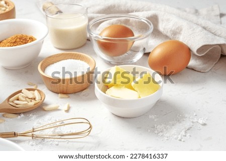 Similar – Image, Stock Photo Brown eggs and baking ingredients on a kitchen table. Rustic style.