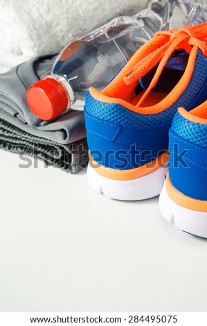 Fitness gym accessories with sport shoes and clothing