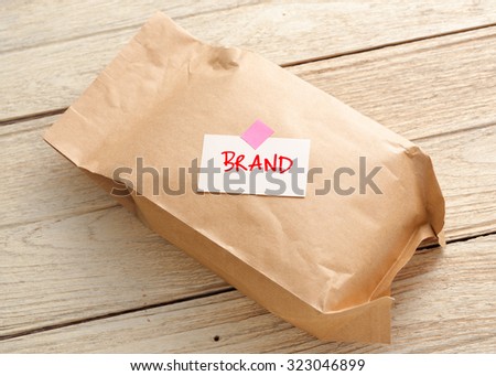 Product paper bag with branding concept on wood table