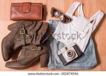 Barcelona, Spain. 27 May 2015. Outfit of Young Woman, Modern and Photographer in Wooden Background.
