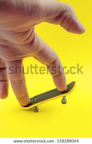 Mini Skate Board Toy in Yellow background. 商業照片 © 