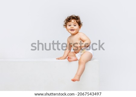 Similar – Image, Stock Photo beautiful baby girl laughing at home sitting on the sofa