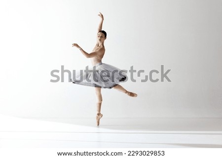 Similar – Image, Stock Photo Slender ballerina in ballet pose on stool