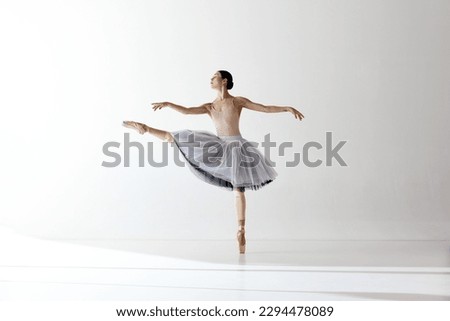 Image, Stock Photo Slender ballerina in ballet pose on stool