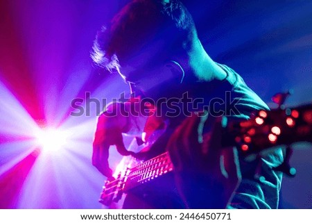 Similar – Image, Stock Photo Musician playing guitar and singing