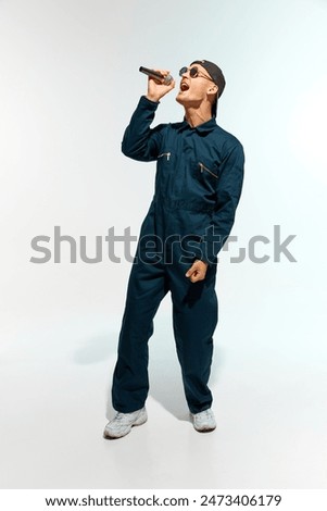 Similar – Image, Stock Photo Male musician with microphone in studio