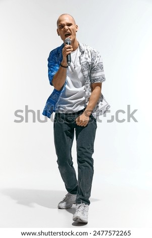 Similar – Image, Stock Photo Male musician with microphone in studio
