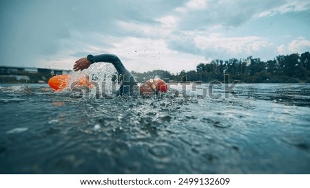 Image, Stock Photo Female athlete in wetsuit on calm lake shore