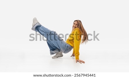 Similar – Image, Stock Photo Dreamy woman raising leg while standing near fence