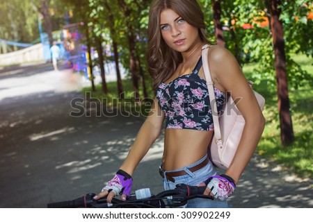 sexy cute sport girl on sports bike