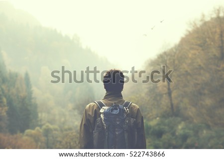 Image, Stock Photo Hiker observing forest in binoculars