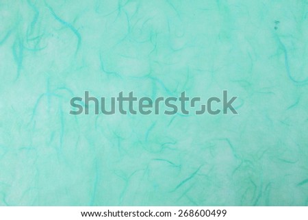 Textured decorative Japanese rice paper. Abstract background. Bright turquoise. Backgrounds & textures shop.