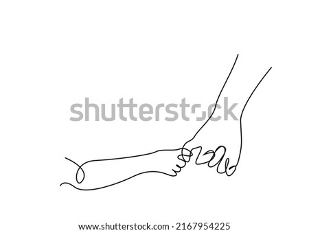 A small child's hand and a large human hand hold hands.