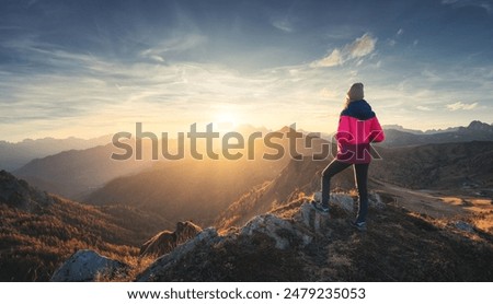 Similar – Image, Stock Photo Beautiful sunset on the lake with distant silhouette of mountains and sun setting above water. Orange and red color sunset in the natural park horizontal banner.