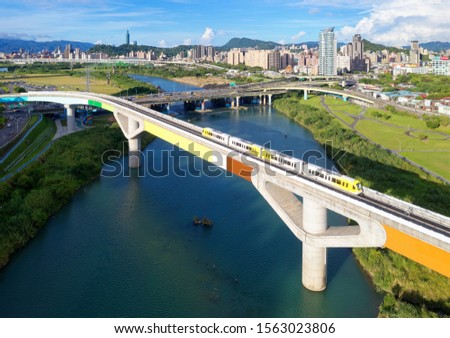 Image, Stock Photo Train on bridge amid lush plants in mountains