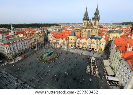 Aerial view of Old Town Square Prague with Gothic Tyn Church on one side and the statue of Jan Hus in the center.