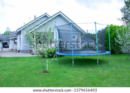 Similar – Image, Stock Photo Trampoline on a lawn in the sunset with two kids