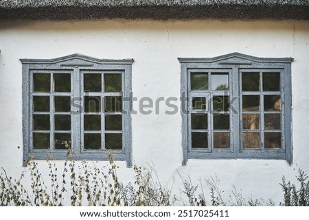 Image, Stock Photo Old grey wooden window with fly screen in the dilapidated corrugated iron facade of an old house in summer sunshine in the province in the village of Maksudiye near Adapazari in the province of Sakarya in Turkey, photographed in neo-realistic black and white