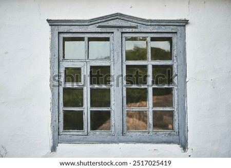 Similar – Image, Stock Photo Old grey wooden window with fly screen in the dilapidated corrugated iron facade of an old house in summer sunshine in the province in the village of Maksudiye near Adapazari in the province of Sakarya in Turkey, photographed in neo-realistic black and white