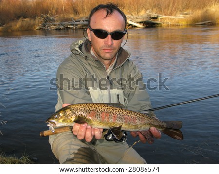 Fisherman with fish (lenok trout - Mongolia)