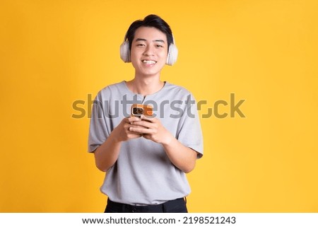 Similar – Image, Stock Photo Young Man with Earphones Posing in Autumn Park