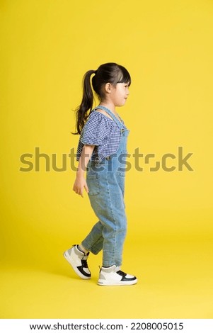 Similar – Image, Stock Photo Beautiful Asian girl walking on the beach in Autumn during her trip
