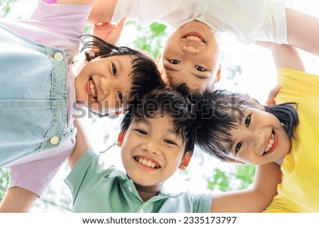 Similar – Image, Stock Photo Group of children playing on beach next to cave