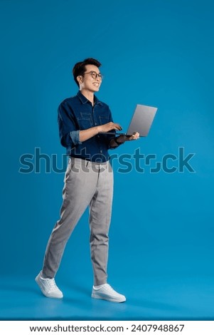 Image, Stock Photo Confident Asian man walking along city street