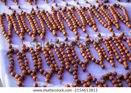 wooden rosaries on the table, mosque rosary. stress stones. brown stones strung on a thread. traditional icon. Imagine de stoc © 