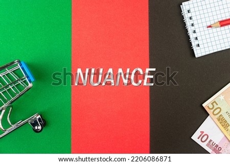NUANCE - word (text) and euro money on a table of different colors, a trolley, a basket of grocery notepad and a red pencil. Business concept, buying, selling, supermarket, store (copy space). Photo stock © 