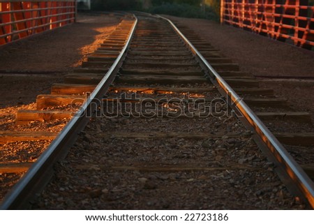 train tracks at sun set
