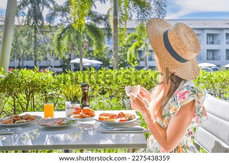 Similar – Image, Stock Photo Unrecognizable female traveler enjoying sunny day on rocky seashore