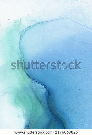 Abstract blue art with green — light blue background, beautiful smudges and stains made with alcohol ink. Turquoise fluid art texture resembles fog, smoke, air, water, watercolor or aquarelle.