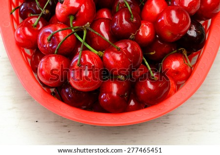 A basket of organically grown bing cherries in a local fruit market at Ellensburg, Washington, US